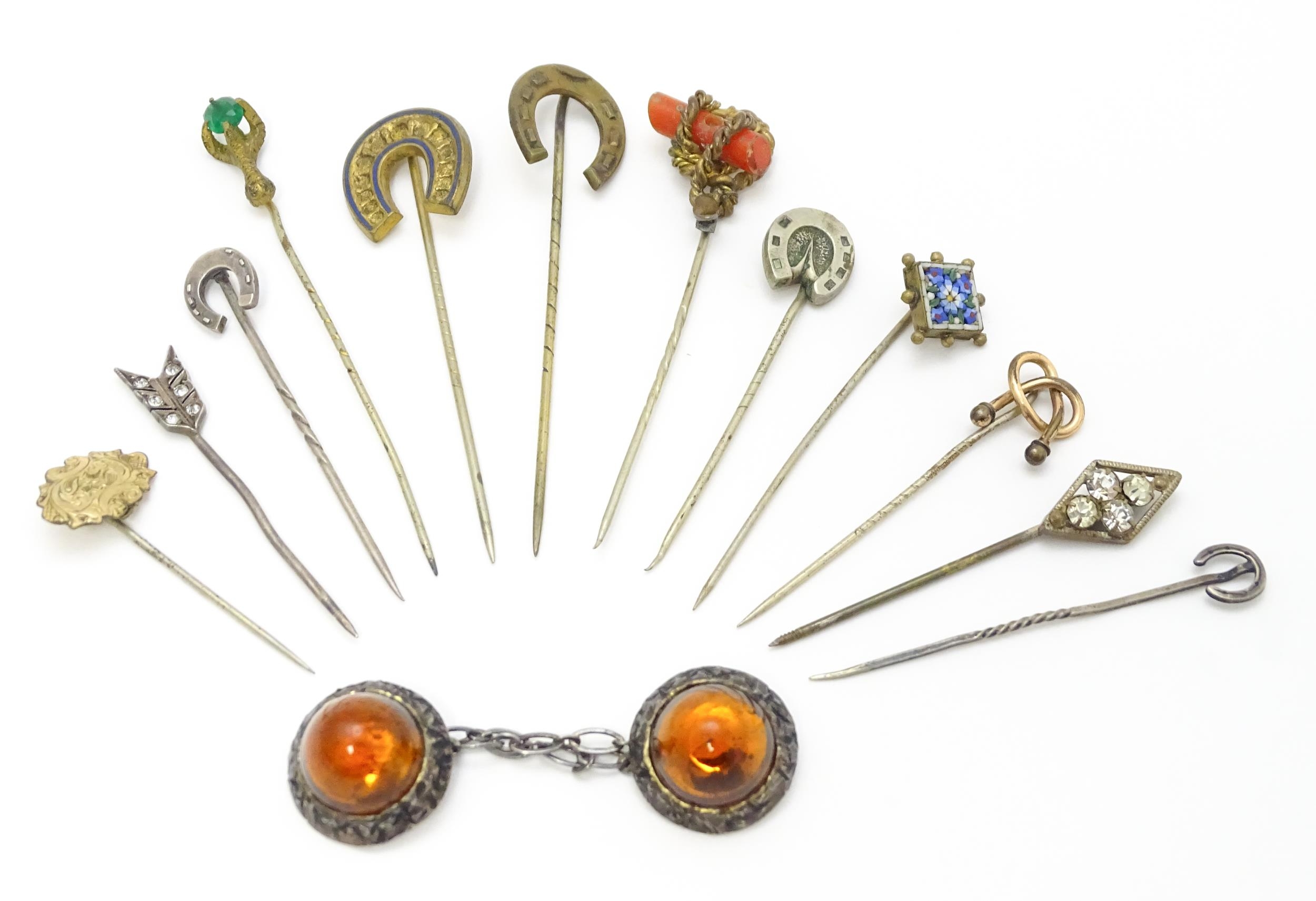 Twelve assorted stick pins to include examples with horse shoe finials, micro mosaic detail, etc.