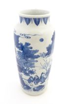 A Chinese blue and white vase decorated with a procession of figures in a landscape. Approx. 15 1/4"