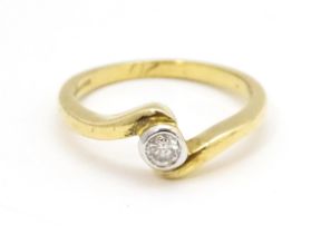 A 9ct gold ring set with central diamond. Ring size approx. O 1/2 Please Note - we do not make