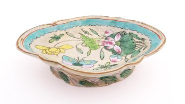 A Chinese footed dish of shaped form decorated with flowers, foliage and butterflies. Approx. 2"