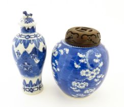 A Chinese blue and white lidded vase decorated with a landscape scene with warriors, the lid