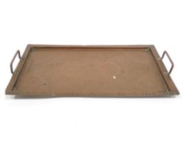 A 20thC copper tray of rectangular form with twin handles and hammered decoration. Approx. 20 1/4" x