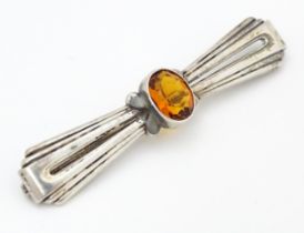 A Continental .835 silver brooch set with central citrine. Indistinctly marked. 2 1/2" wide Please