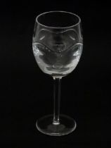 A Tyrone Crystal pedestal wine glass, with indented roundel and wave decoration, hexagonal stem