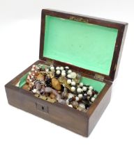 A box containing an quantity of assorted jewellery to include brooches, beads etc. Please Note -