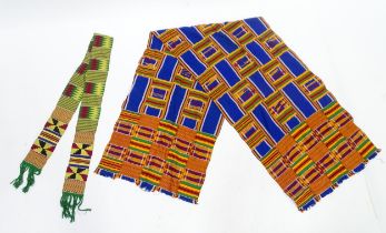 Two African fabrics / textiles comprising a scarf and a shawl / wrap, the largest approx 73" x