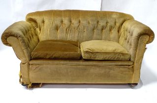 A Victorian two seater button back sofa, with drop-end mechanism to each arm. Measuring approx 68"