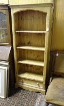 A modern stripped pine four-tier bookcase with single lower drawer, standing 71" tall, 30" wide, 11"