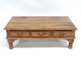 A coffee table with six drawers, approx 43" long Please Note - we do not make reference to the