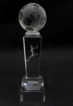 A glass football trophy of tapering form with footballer detail to centre. Approx. 6 3/4" high