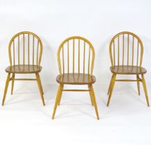 Three elm and beech stick back Windsor chairs in the manner of Ercol. 17" wide x 16" deep x 32"