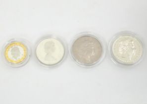 Four commemorative coins , comprising a 1986-1986 Canada Dollar coin , a 1999-2000 five pounds