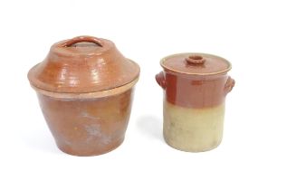 A large salt glazed terracotta crock and cover, together with a stoneware pot and cover. The largest