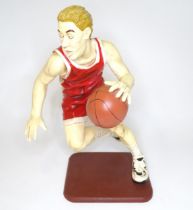 A model of a basketball player with cast signature for Jun Asilo 97. Approx. 17 1/2" high Please