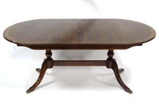 A late 20thC mahogany dining table, with joined pedestal base and shaped & inlaid top, approx 72"