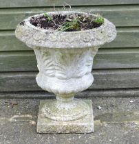 A reconstituted stone planter of classical urn form, standing approx 20" tall Please Note - we do