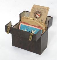 A mid 20thC record case, containing a quantity of 78rpm vinyl records, including Capitol Junior