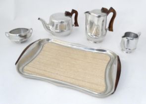A quantity of teawares to include a Picquot Ware teapot and hot water pot, etc. Tray approx. 16 3/4"