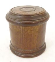An early 20thC turned mahogany treen box and cover / container of cylindrical form with banded