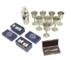 Assorted items to include 8 Crown and Rose pewter goblets, 8 pewter napkin rings, a cocktail