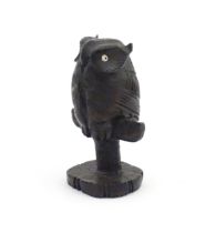 An early 20thC carved wooden model of an owl on a perch. Approx. 4 1/4" high Please Note - we do not