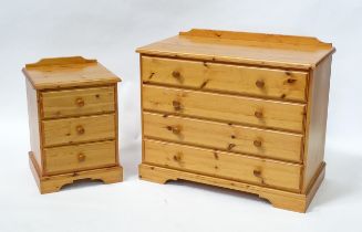 A modern pine chest of drawers comprising four long drawers, together with a bedside cabinet with