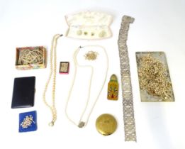 A quantity of various pearls necklaces, a silver plate belt, assorted compacts, etc. Please Note -