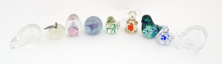 A quantity of assorted glass paperweights to include examples modelled as birds etc. makers