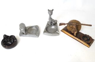 A quantity of assorted 20thC novelty ashtrays to include one with shotgun and dog head detail, one