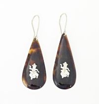 A pair of tortoiseshell drop earrings. Approx 1 1/2" long Please Note - we do not make reference