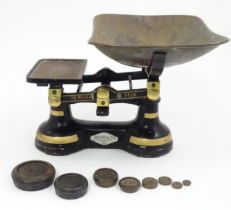 Cast iron balance scales by Davies & Co. of Colchester. Together with eight weights. Approx. 11"