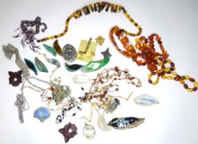A quantity of assorted costume jewellery to include beads, brooches etc Please Note - we do not make