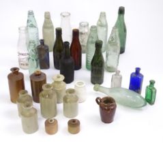 A quantity of assorted glass and stoneware bottles to include codd bottles, beer bottles, milk