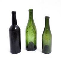 Three 19thC glass wine bottles. Largest approx 12" high (3) Please Note - we do not make reference