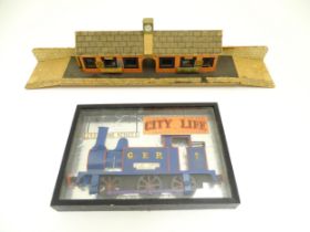 Toys: A 20thC scratch built wooden model railway station / platform with various adverts for