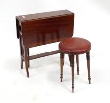 An early 20thC mahogany drop flap / Sutherland table with canted corners, together with a leather