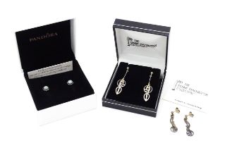 A pair of Pandora silver earrings together with two pairs of silver earrings inspired by the designs