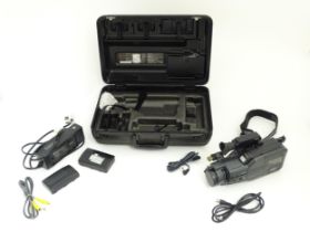 A cased Panasonic MC90 VHS-C video camera. Please Note - we do not make reference to the condition