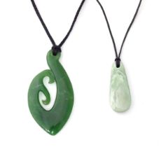 A Jade coloured hardstone pendant together with another (2) Please Note - we do not make reference