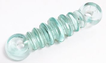A 20thC glass radio strain insulator marked 10A - 7652. Approx. 7" long Please Note - we do not make
