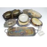 A quantity of assorted silver plated wares to include entree dishes, trays, bread plates, etc.