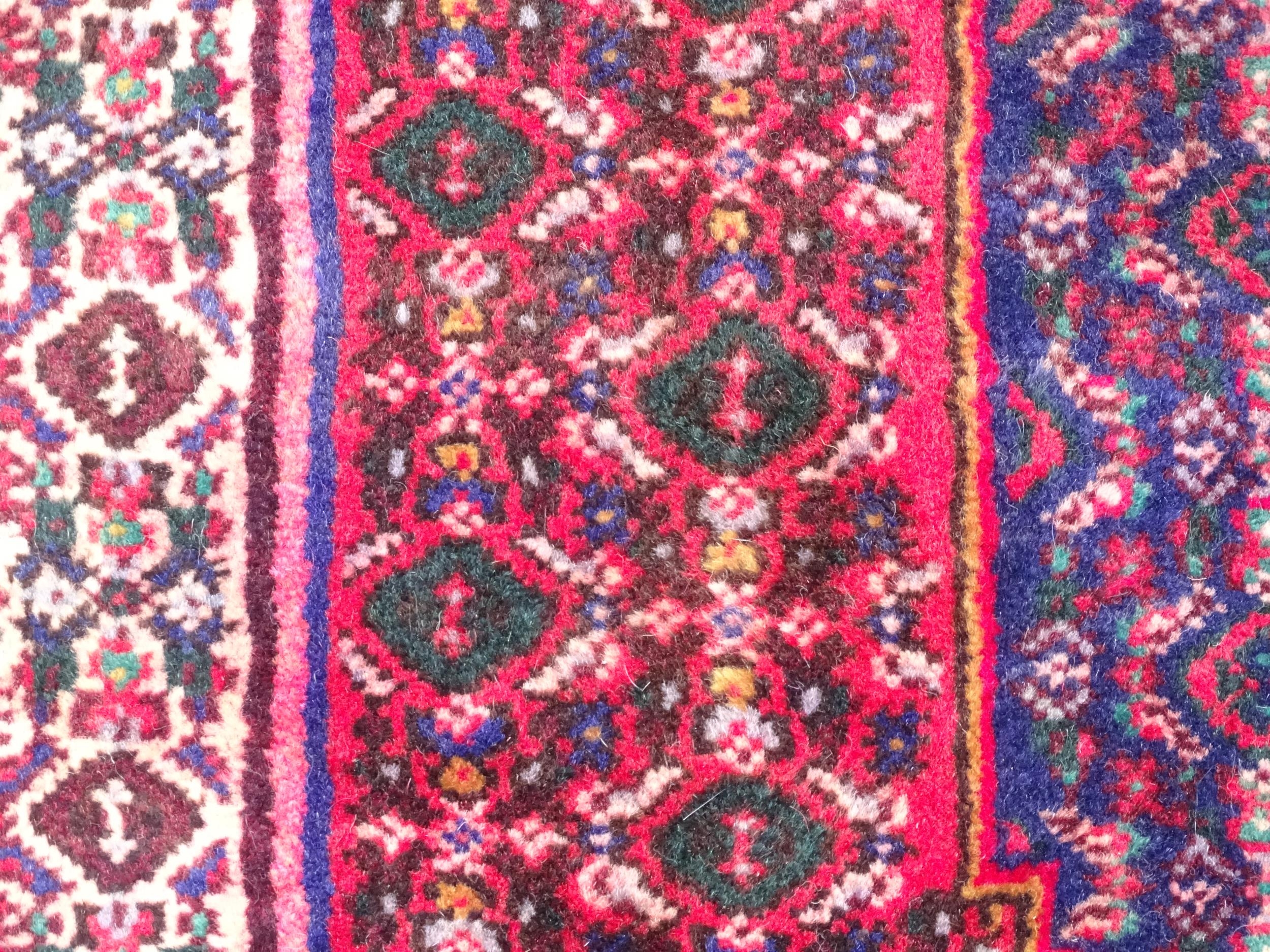 Carpet / Rug: A North West Persian Senneh rug, the red, blue and cream grounds decorated with - Image 7 of 7