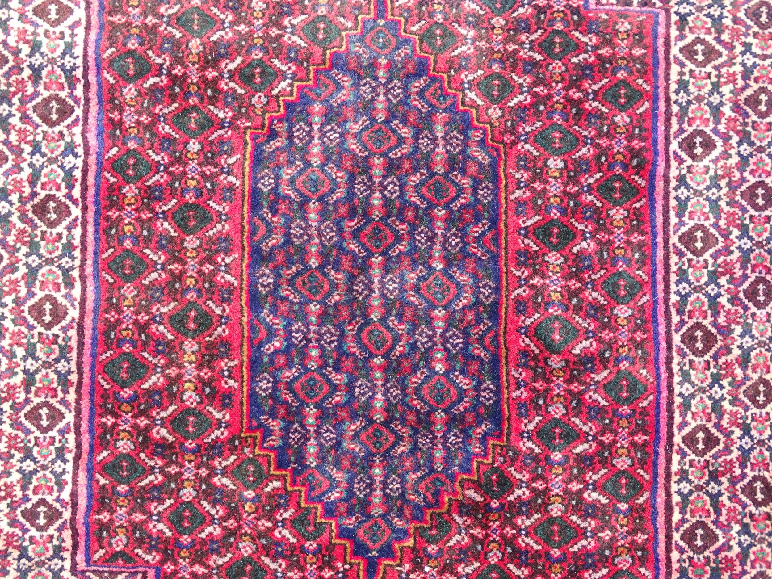 Carpet / Rug: A North West Persian Senneh rug, the red, blue and cream grounds decorated with - Image 6 of 7