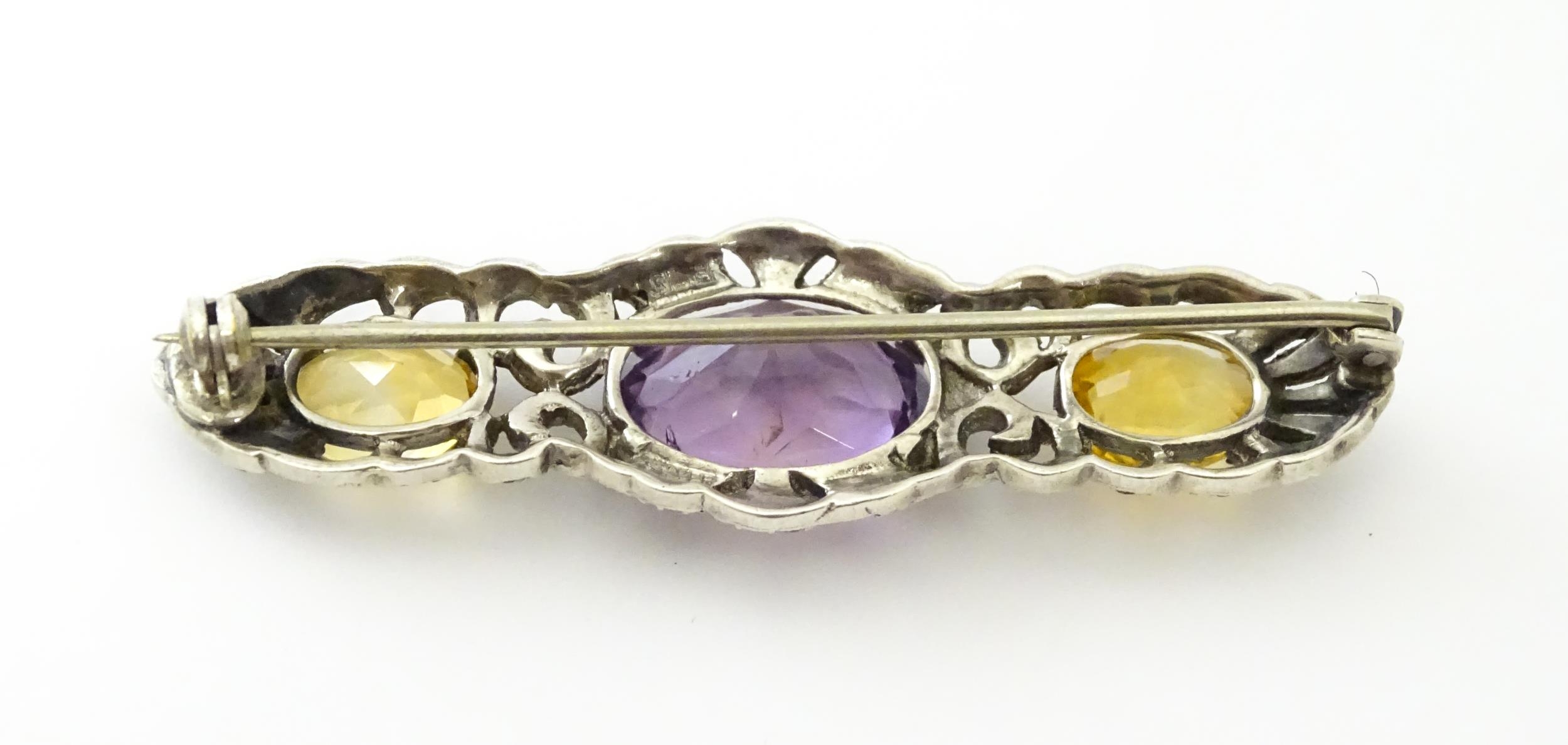 A silver brooch set with amethyst, citrine and marcasite. Approx 2 1./4" wide Please Note - we do - Image 6 of 8