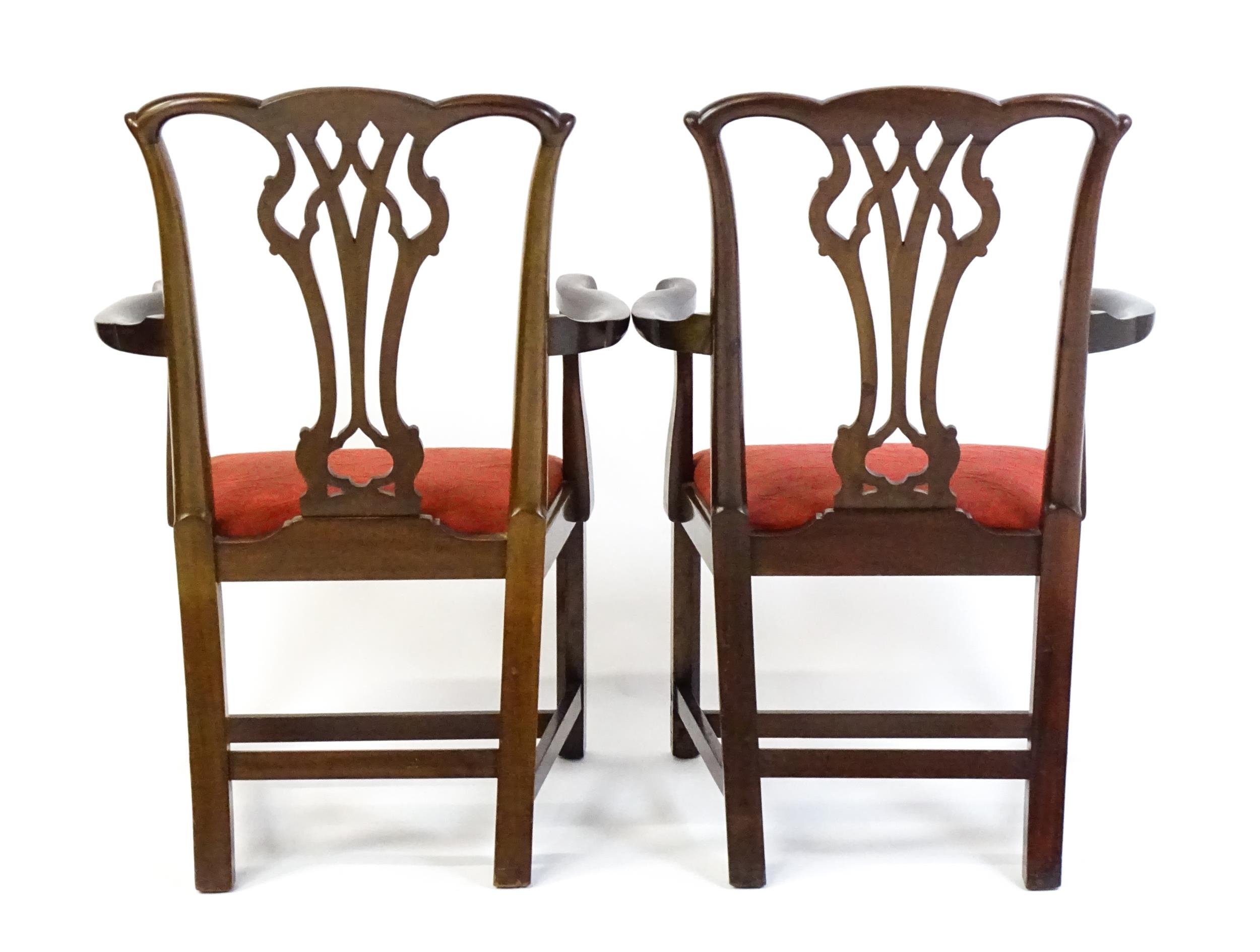 A pair of Chippendale style mahogany elbow chairs with a drop in seat raised on chamfered legs - Image 7 of 7