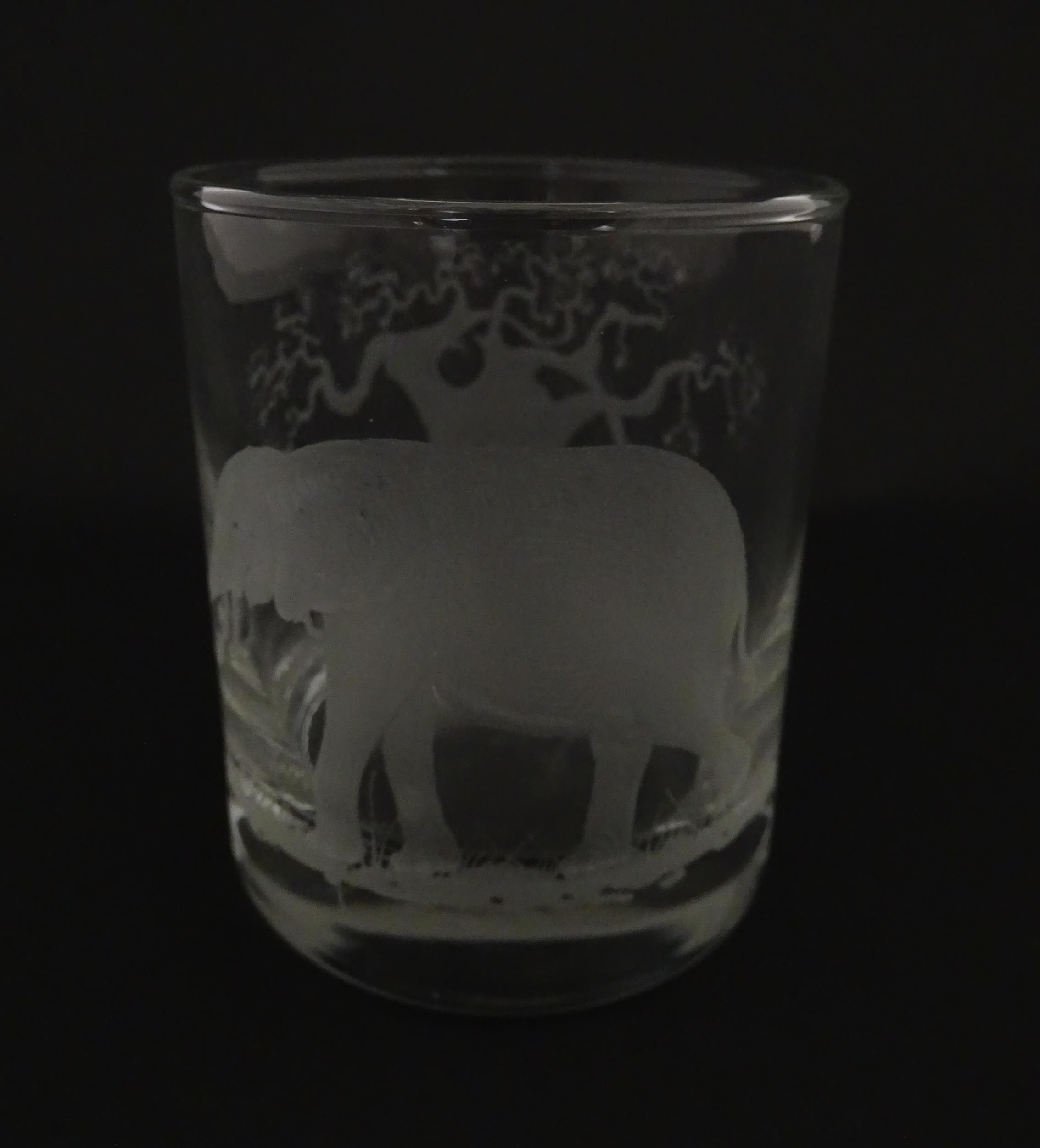 A Rowland Ward decanter glass with engraved Safari animal detail. Unsigned. Together with a similar - Image 9 of 11