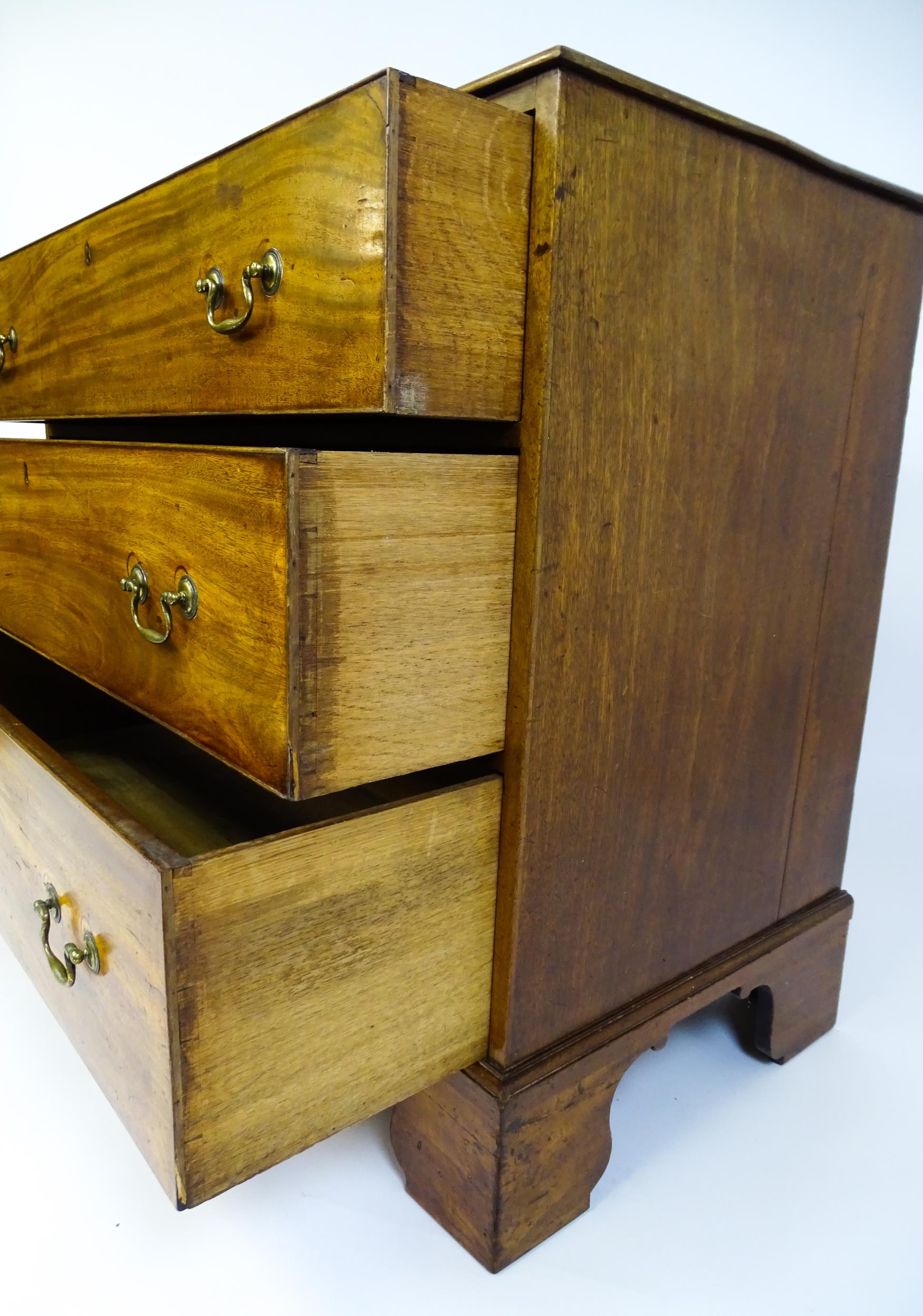 A late Georgian mahogany chest of drawers with a rectangular moulded top above three long drawers - Image 9 of 10