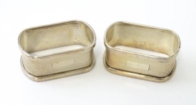 A pair of Art Deco silver napkin rings with engine turned decoration, hallmarked Birmingham 1936,