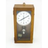 Lepaute : An early 20thC oak cased electric clock. The white dial with Arabic numerals signed