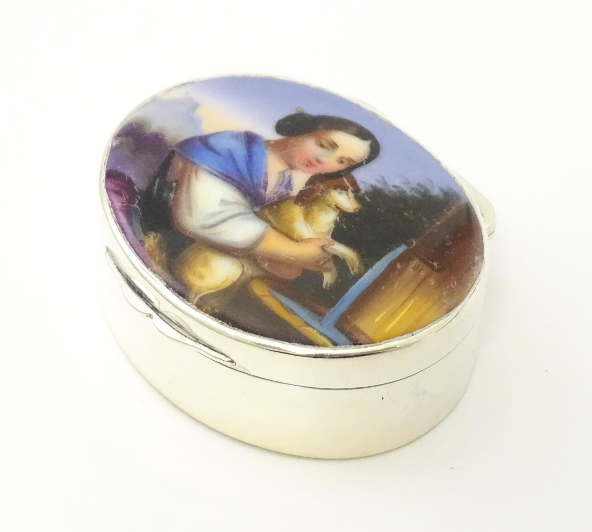 A silver pill box with gilded interior and ceramic cabochon to lid depicting a young girl holding - Image 5 of 9